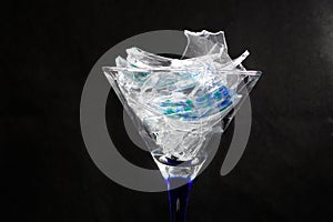 Broken glass photographed in front of black background