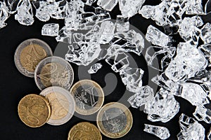 Broken glass pieces and euro money. Accident, Danger, Insurance and Success Concept