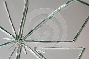 Broken glass pile pieces of texture and background isolated on white, cracked window effect. Emergency condition