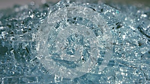 Broken glass rotates on the table. Close up