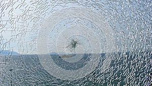 Broken glass with sea on background