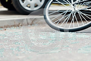 Broken glass on the street after a car accident with cyclist