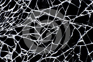 Broken glass tablet computer. Cracked screen. Close up of cracked glass surface