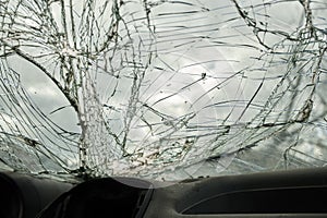 Broken glass texture, car windshield after traffic accident, shattered glass material background