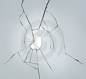 Broken glass on white background with hole