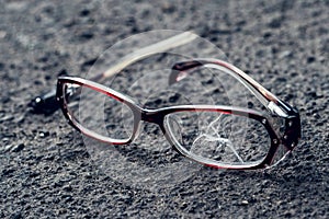 Broken glasses fell on the asphalt. Accident