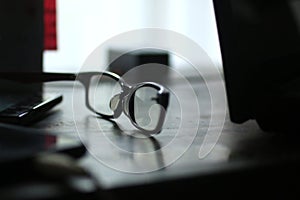 Broken glasses on a table. Vision concept.