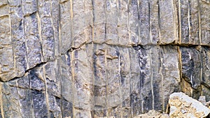 Broken granite stone wall