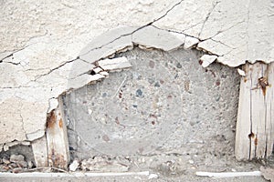 Broken gritty concrete cover on cinder blocks