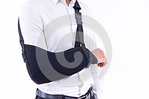 Broken hand wearing an arm brace