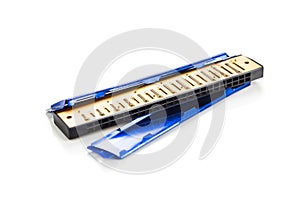 Broken harmonica cover plate isolated in white background