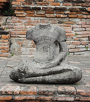 Broken headless Buddha