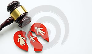 Broken heart with family as a divorce concept and a gavel symbolizing the law.