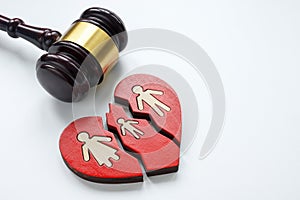 A broken heart and a gavel as a symbol of divorce, alimony and custody. photo