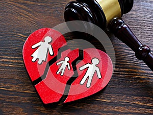 Broken heart and gavel as symbol of divorce and guardianship.