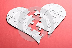 Broken heart made of puzzle