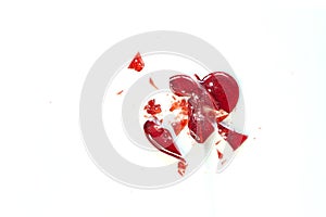 Broken heart red lollipop sweet isolated on white background