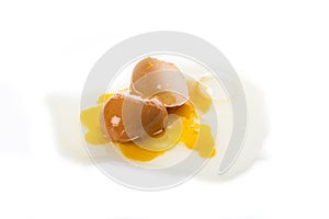 Broken hen`s egg, isolated on a white background photo