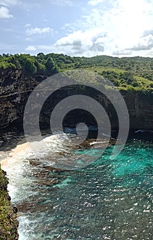 Broken hollow rock on the beautiful Nusapenida island. photo
