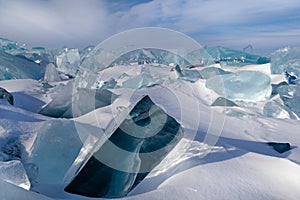 Broken ice floes among snow in winter