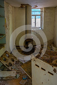 Broken interior of a village house in the Chernobyl Exclusion Zone in the Ukraine