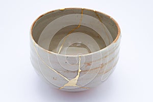 Broken Japanese handmade bowl restored with the antique japanese kintsugi real gold technique