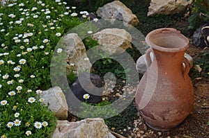Broken Jar on a garden photo