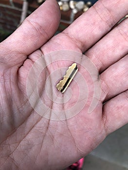 Broken key part in hand