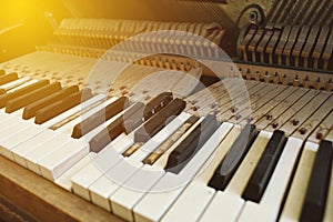 Broken Keys on a Piano with Dust and Warm Lighting - Concept Antique Neglect