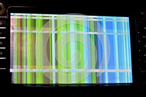 Broken LCD screen with multiple colors and pixelations with color errors and problems forming abstract color stripes background photo