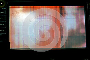 Broken LCD screen with multiple colors and pixelations with color errors and problems forming abstract color stripes and patches photo