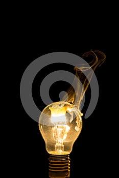 Broken light bulb burn out with flame