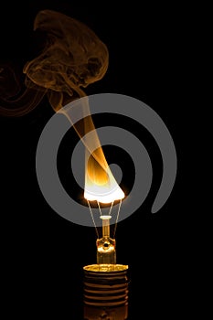 Broken light bulb burn out with flame