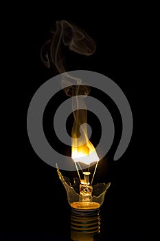 Broken light bulb burn out with flame