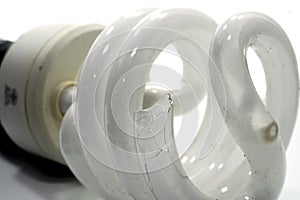 Broken light bulb on white background