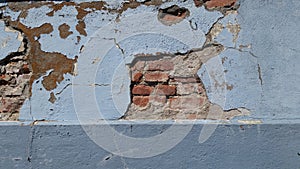 Broken mortar on brick wall