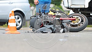 Broken motorcycle on the road accident site