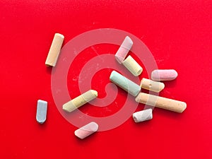 Broken multicolored chalk pieces