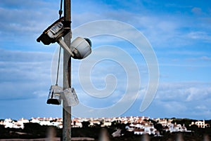 Broken old abandoned surveillance cameras. Rust eaten damaged CCTV Security cams