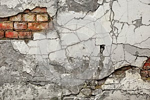 Broken Old Bricklaying From Red White Bricks And Damaged Plaster photo