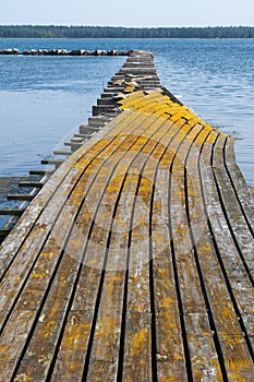 Broken old jetty in yellowish color