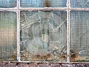 Broken old window glass in warehouse.