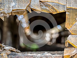 Broken old window glass in warehouse.