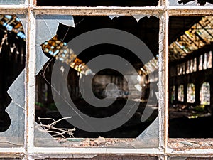Broken old window glass in warehouse.