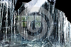 Broken old window with reflections.