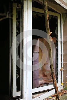 Broken and open window with glass shards