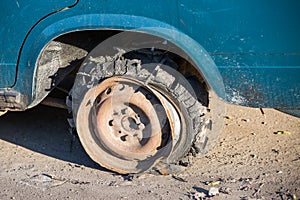 Broken overheated car tire photo