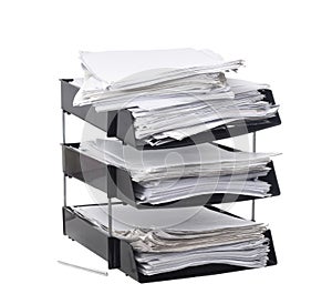 Broken, overloaded office paper filing trays isolated on white background. Concept. Lots of paperwork, work, bureaucracy