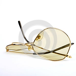 Broken pair of glasses isolated on a white background