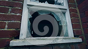 Broken Pane of Wire-Reinforced Window Glass in Vandalised Derelict Building